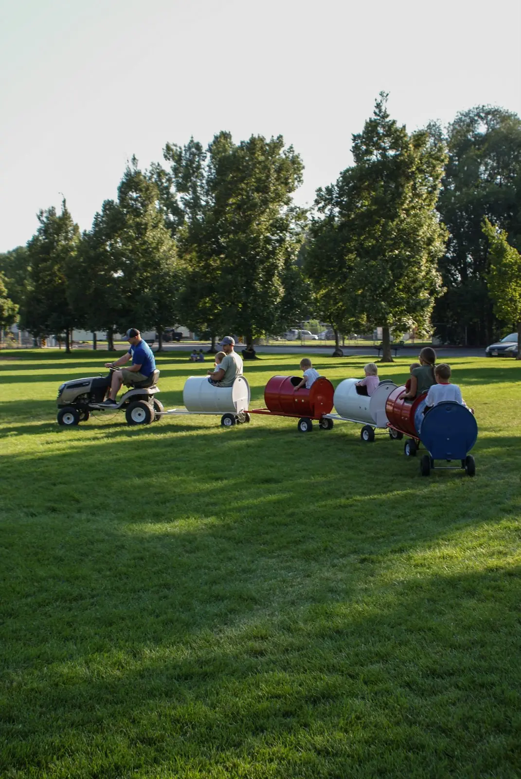 Kids riding the Backyard Barrel Express