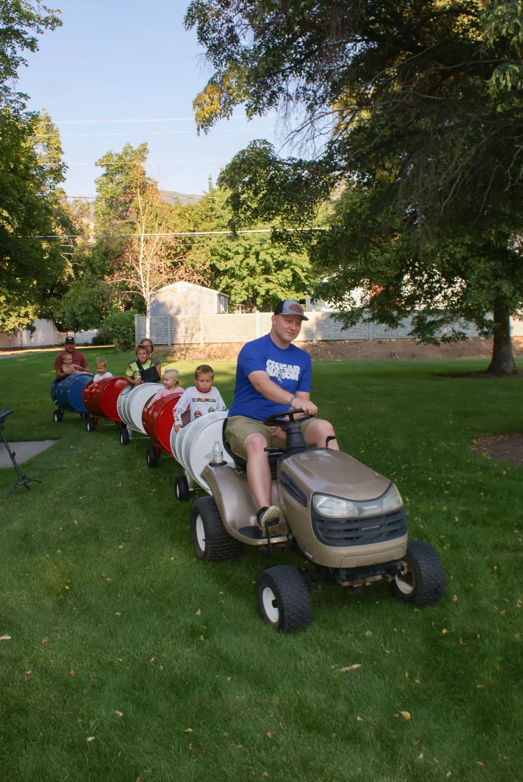 Kids riding the Backyard Barrel Express