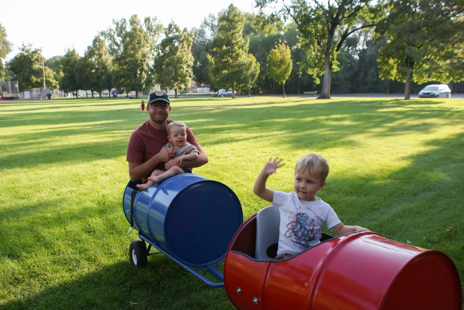 Kids riding the Backyard Barrel Express