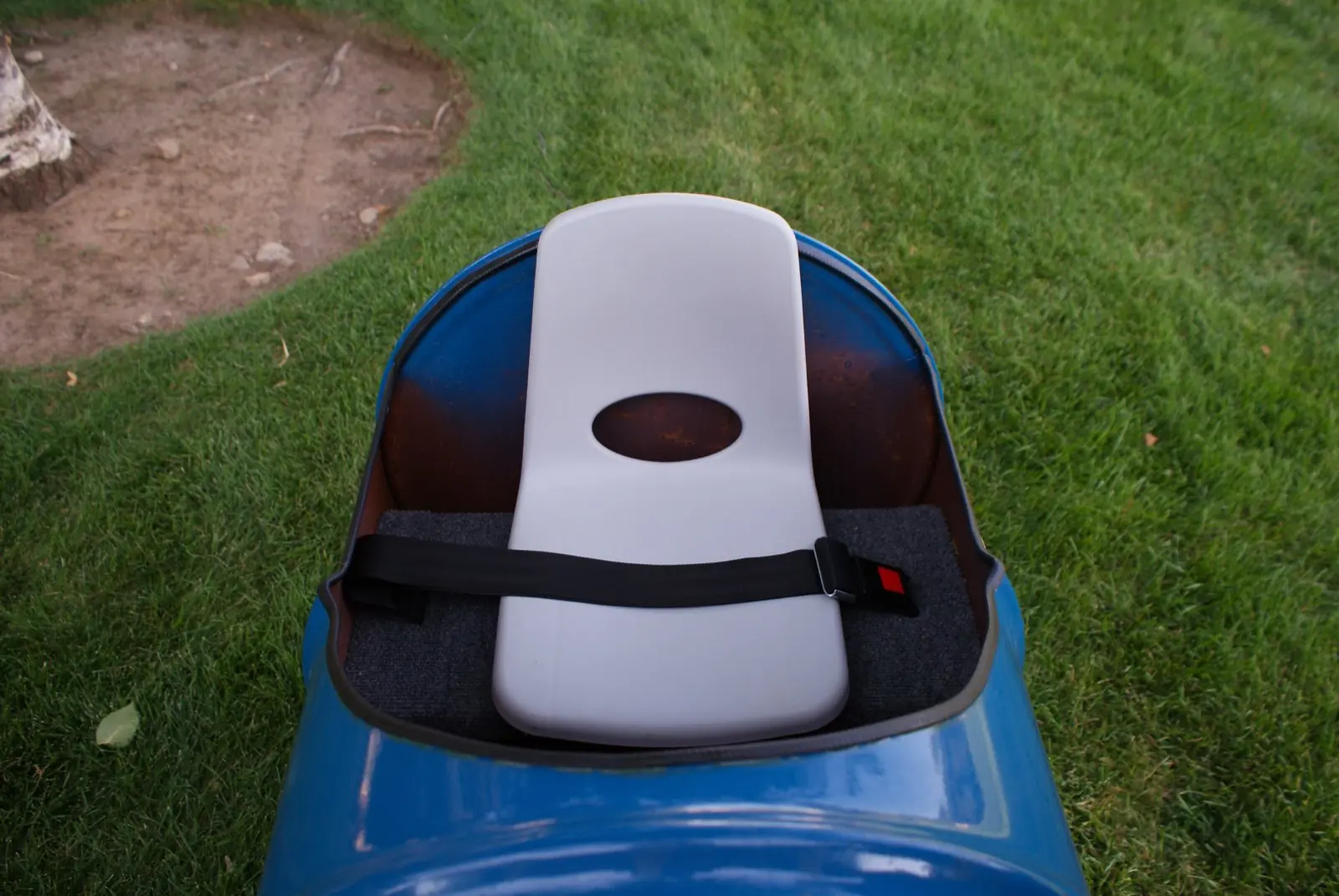 Close-up of a barrel car seat and harness